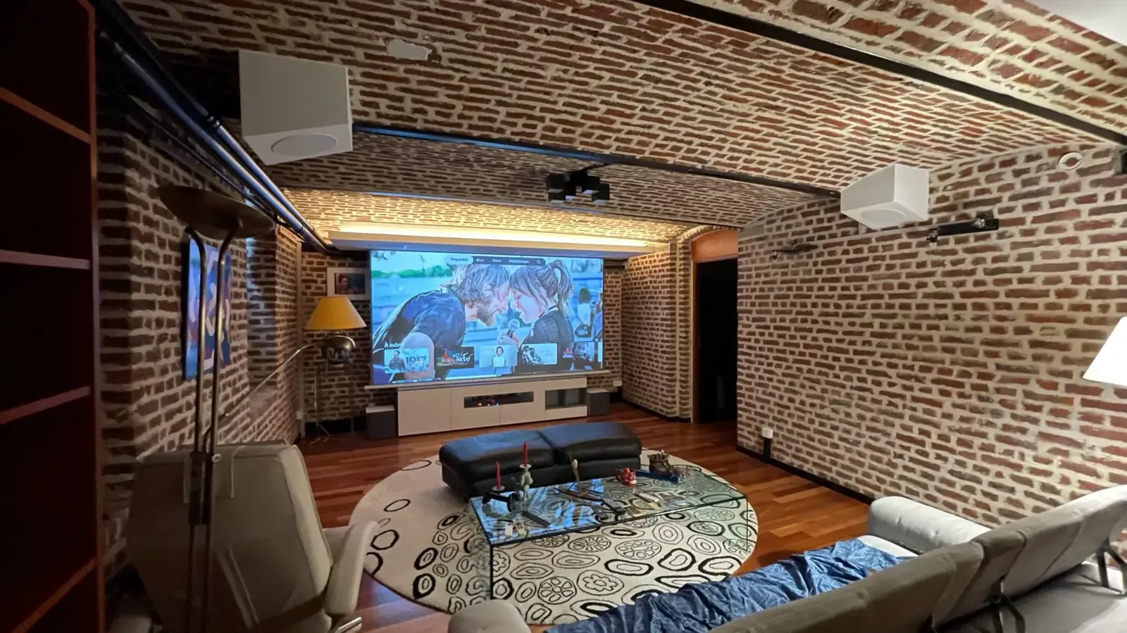 Brick living room fitted with a screen