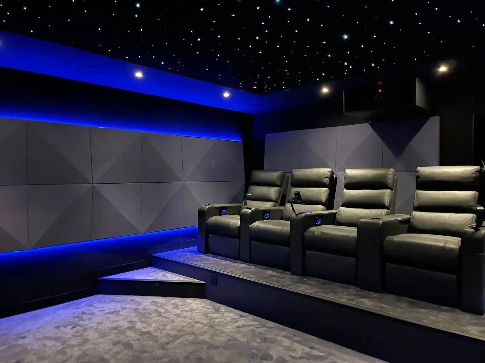 Room with blue light strips and a riser